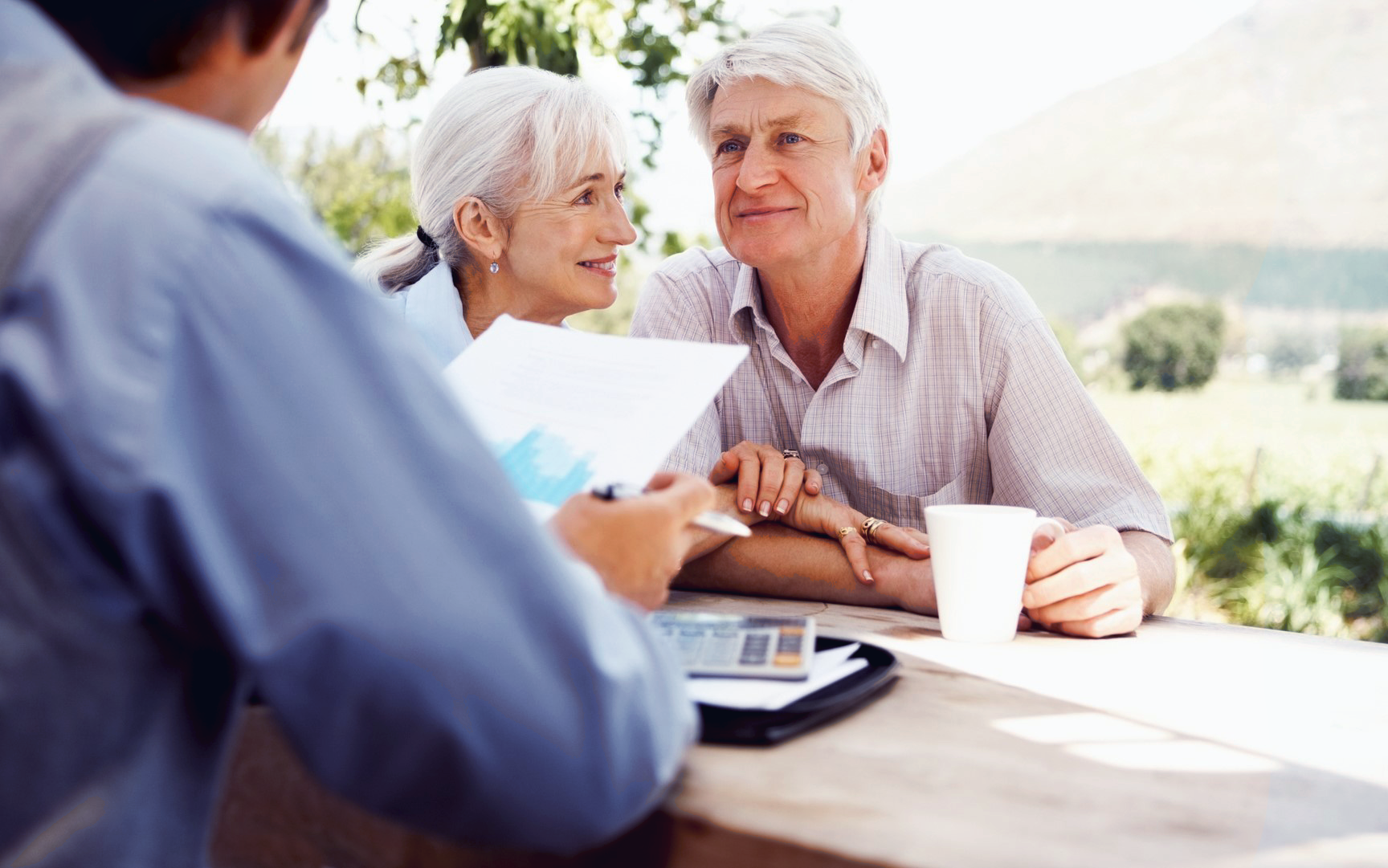 A construction consultant helping an older couple